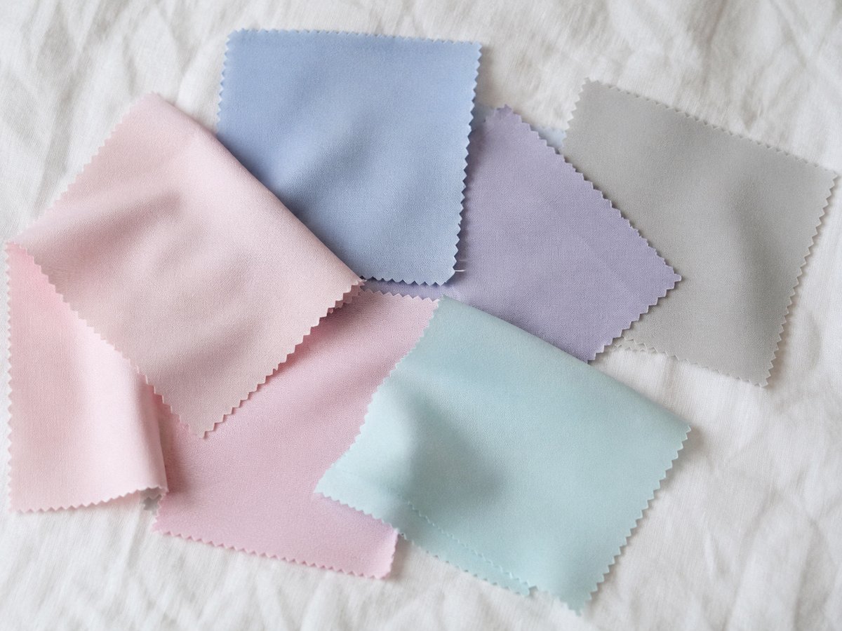 Light Summer colour palette featuring powder pink, pale blue, soft lavender and pearl grey fabric swatches